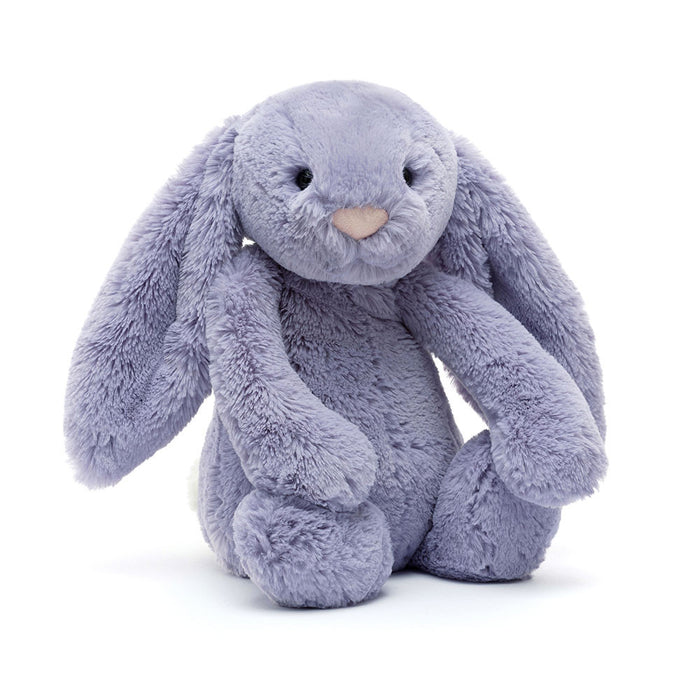 Plush toy rabbit in purple on a white background