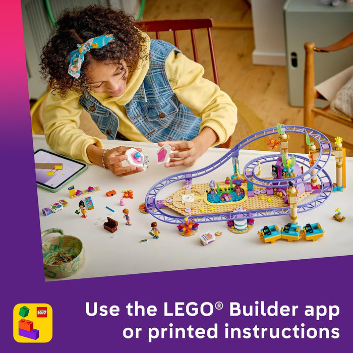 Child playing with a LEGO roller coaster set on a table, with LEGO branding visible.