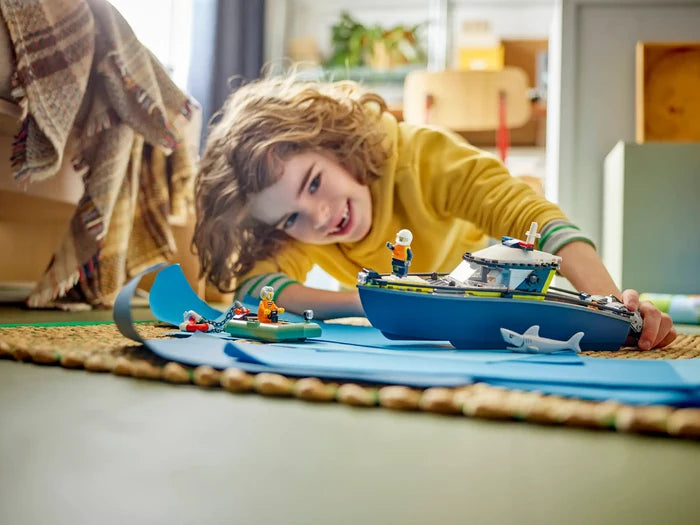 Child playing with a toy boat on a rug indoors