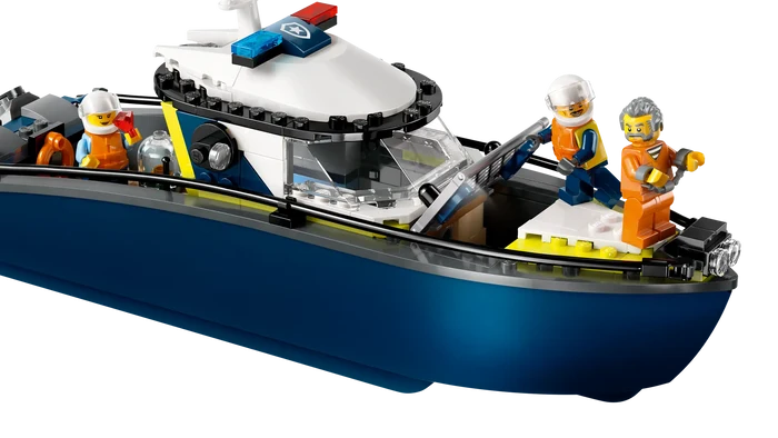 Toy boat with a police helicopter on top and toy figures on a white background
