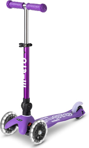 Purple scooter with large wheels on a white background