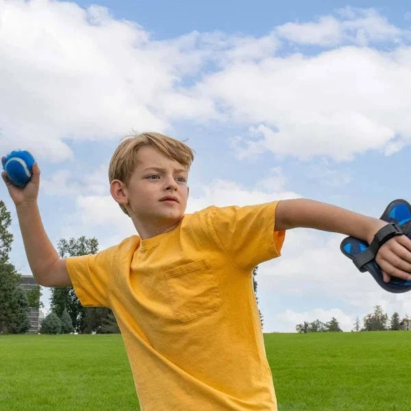 Child using resistance bands outdoors on a sunny day